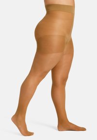 Collant trasparenti color carne con vita alta. Il materiale è liscio, con una leggera lucentezza. Il design con piede presenta una punta rinforzata e sezioni rinforzate sulla coscia.