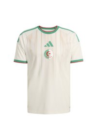 White soccer jersey with green and red accents, featuring a round neckline, short sleeves, diagonal stripes, and Algeria emblem in center.