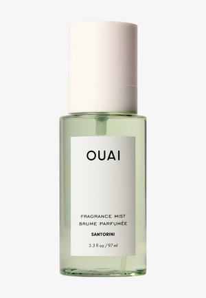 Bruma de fragancia OUAI Santorini en botella transparente con tapa de spray blanca, 3.3 fl oz (97 ml), texto negro minimalista en etiqueta blanca.