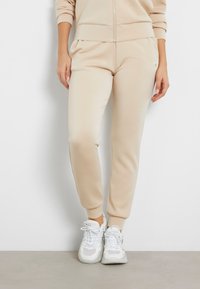 Guess - MID WAIST JOGGING - Pantaloni sportivi - beige Immagine in miniatura 1