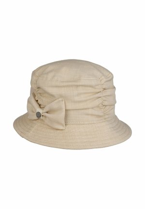 Beige fabric bucket hat with gathered sides and a matching fabric bow accented by a small round metal logo.