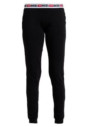 Leggings neri realizzati in tessuto elastico, con una cintura bianca che presenta un logo rosso e nero. Design aderente con polsini alla caviglia.