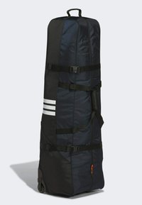 Vagnväska i svart och navy tyg, med justerbara remmar, tre vita ränder och ett robust handtag på toppen.