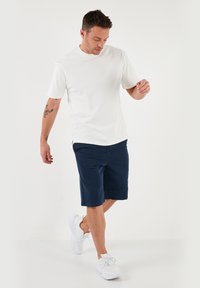 Buratti REGULAR FIT - Verryttelyhousut - indigo