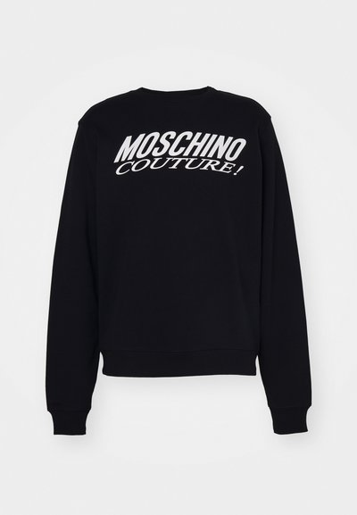 Felpa nera con maniche lunghe e polsini a coste. Presenta il testo bianco "MOSCHINO COUTURE!" in evidenza sul petto.