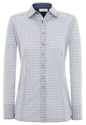 Chemise blanche à manches longues avec boutons, motif géométrique circulaire bleu marine et doublure intérieure de col bleu marine, coupe ajustée.