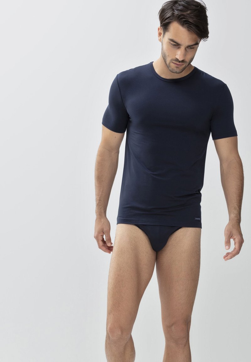 Navy short-sleeve fitted t-shirt made of soft fabric, paired with matching fitted briefs; smooth texture and minimal branding detail.
