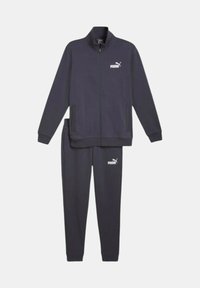 Tuta blu navy realizzato in tessuto liscio. Giacca con zip e tasche laterali, pantaloni abbinati con dettagli del logo su entrambi i pezzi.