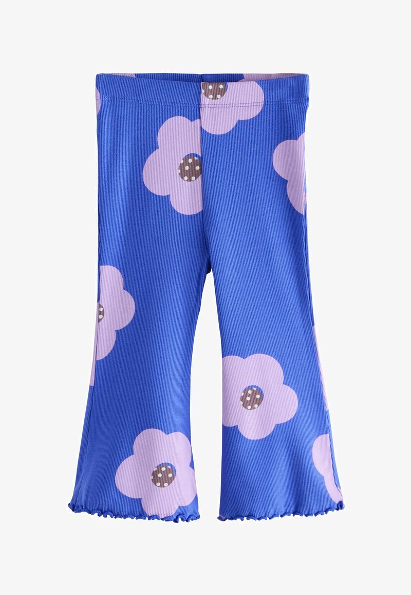 Pantaloni a zampa in tessuto blu a costine con grandi fiori rosa e pois marroni. I pantaloni hanno un orlo arricciato e una vita elastica.