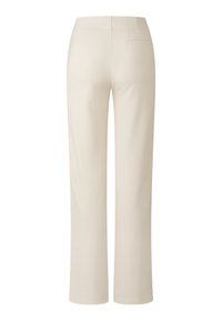 Pantalons beiges à jambes larges en tissu doux, dotés d'une poche arrière et d'une taille lisse et ajustée.