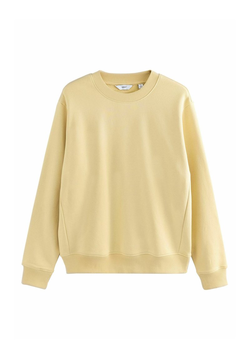 Crèmegele katoenen sweatshirt, ronde hals, lange mouwen, ribgebreide manchetten en zoom, gladde textuur, iets oversized pasvorm.