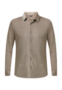 Chemise beige à manches longues, à boutons, texture douce, léger éclat, et un col classique. Présente des boutons espacé uniformément sur le devant.