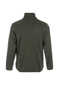 Grön texturerad jacka med hög krage, långa ärmar och avslappnad passform. Tyget visar ett subtilt melerat mönster.