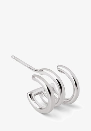 Silvrig hårnål med tre kurviga slingor, stilren design med en polerad yta och en smal baksida för säker fästning.