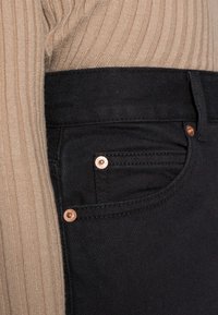 Dr.Denim Petite NORA  - Calças de ganga de corte relaxado - washed black stretch