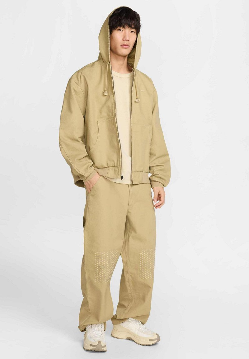 Nike Sportswear Lichte jas beige Nike Sportswear Lichte jas beige