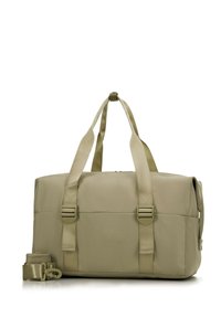Sac de sport beige en tissu durable, équipé de deux poignées robustes, d'une bandoulière réglable et de boucles sécurisées sur les côtés.