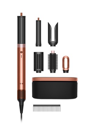 Hair styling tool set includes a rose gold main unit and various black attachments: round brushes, concentrator, case, and comb, with textured surfaces.