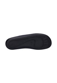 Black shoe sole with textured rubber surface, rounded shape, and visible stitching along the edge, featuring a smooth central area.
