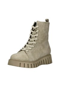 Botas de tobillo de ante beige con cordones planos, que presentan una suela de goma gruesa y un diseño texturizado, diseñadas para la comodidad y la durabilidad.