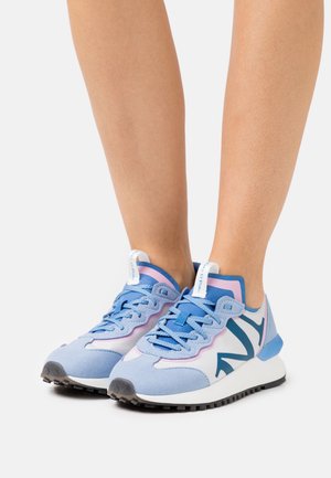 Light blue sneakers with pink accents and dark blue logo. Suede and mesh materials, textured outsole, lace-up design, cushioned collar.