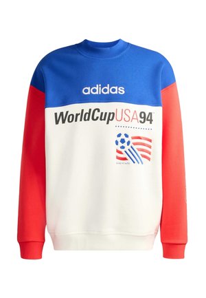 Mikina s modrým horním dílem, bílým tělem, červenými rukávy, logem Adidas, nápisem "WorldCup USA 94" a grafikou fotbalového míče s červenými a bílými pruhy.