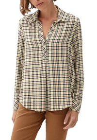 Camicia gialla e marrone a quadri con colletto, dettagli con bottoni sullo scollo e maniche lunghe. Tessuto morbido con vestibilità rilassata.