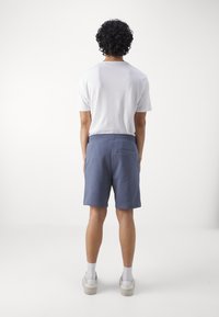 HUGO DIZ - Pantaloni de trening - open blue