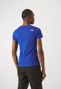 The North Face W SS SD SLIM TEE - Paprasti marškinėliai - blue