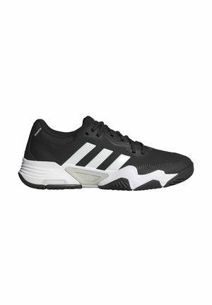 Black athletic shoe with white accents, lace-up design, textured upper, prominent three-stripe logo, and cushioned sole.