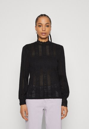 Black knitted top with a high neck and lace trim, featuring vertical patterns, long puff sleeves, and a textured fabric.