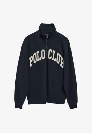 Sudadera de cremallera en azul marino oscuro con un cuello alto y "POLO CLUB" bordado en crema. Confeccionada en tejido suave y con puños de canalé.