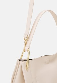 Coccinelle WALLACE - Käsilaukku - off-white/green