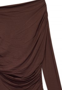 Brown off-the-shoulder top with draped texture, long sleeves, and gathered detailing along the side. Soft, stretchy fabric.