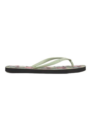 Tongs vertes avec des sangles texturées, présentant un motif coloré de pois sur le lit de pied et une semelle en caoutchouc noire.