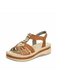 Bruine sandal met decoratieve kralendetail, stoffen bandjes, open teen en een kurken wigzool. Gearticuleerde voetbed voor comfort.