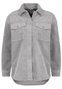 Giacca camicia in corduroy grigia con chiusura a bottone, due tasche sul petto e un orlo posteriore leggermente più lungo. Presenta una texture a coste e colletto rotondo.