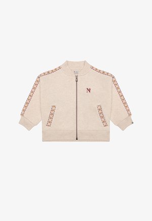 Beige jas met ritssluiting met patroon van sterrenstrepen op mouwen en zakken, geribbelde boorden en zoom, en een klein kastanjebruin "N" logo op de borst.
