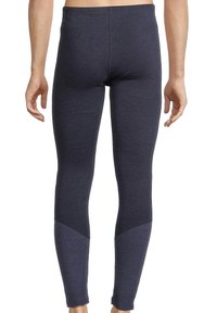Dunkelgraue Leggings aus dehnbarem Material, mit einem strukturierten dunkelblauen Einsatz am Knöchel. Glatte Oberfläche, figurbetontes Design.