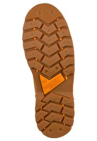 Suela de goma con un patrón de tread multidireccional en color marrón claro, con acentos en naranja y un prominente logo de "Dockers Footwear".