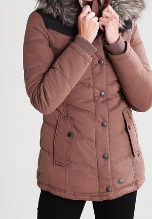 Brown quilted puffer jacket with a faux fur hood, black shoulder accents, and button closures. Includes side pockets and ribbed cuffs.