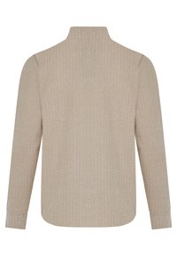 Beige lange mouwen shirt van gestructureerde stof, met een subtiel patroon van zigzaglijnen; hoge hals en afgeronde zoom met gestikte naden.