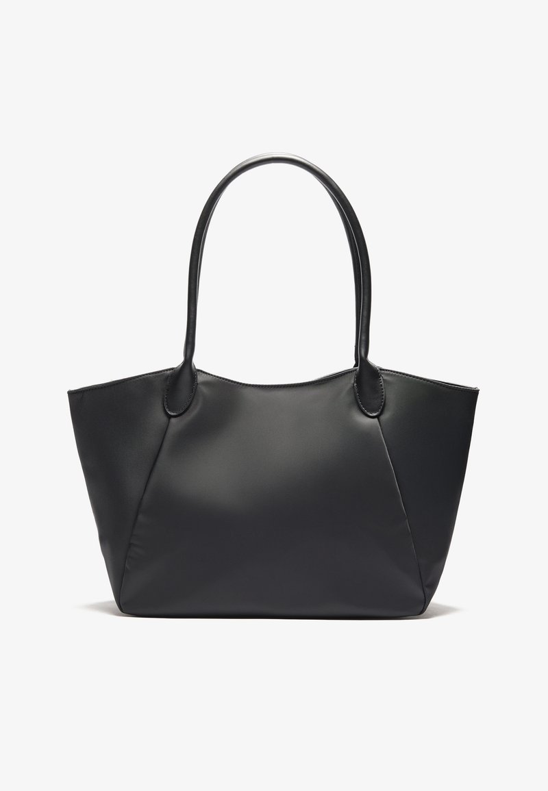 Black leather tote bag with two long handles, smooth texture, and a structured shape, featuring curved seams and no visible hardware.