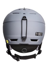 Matte grijze skibril met een zwarte verstelbare riem, ventilatiesleuven, een achterste verstelknop en een gele Mips veiligheidssticker.