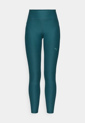 Turkizne atletske legging hlače z visokim pasom, izdelane iz raztegljivega materiala. Imajo majhno.logo na spodnjem desnem delu noge in ravne šive.