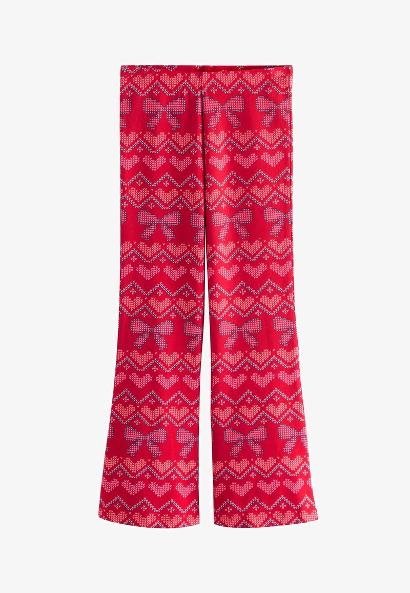 Pantalon rouge avec un motif tricoté de nœuds bleus et de cœurs roses disposés en rangées horizontales.