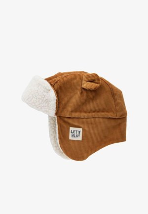 Ruskea corduroy-hattu, jossa on pehmeä ivory-vuori. Hatussa on pieni "LET'S PLAY" -tagi ja ylhäällä säätö- tai tyylitarkoituksiin tarkoitettu silmukka.