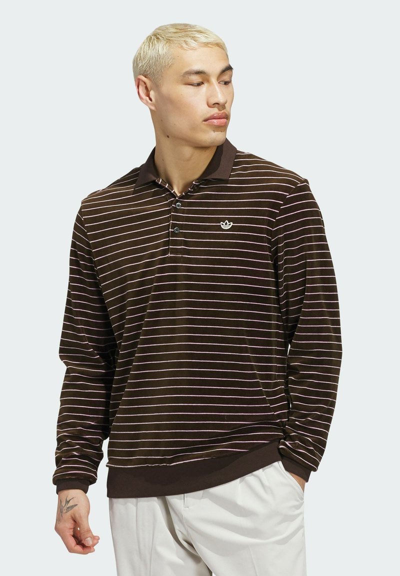 Brown long-sleeve polo shirt with horizontal pink stripes, three-button placket, and contrasting collar. Features small logo.
