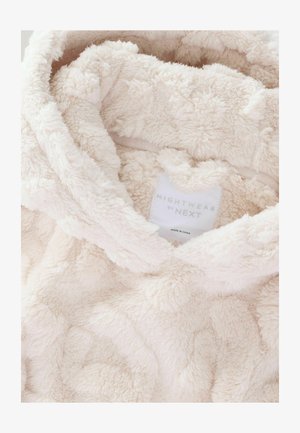 Svijetlosmeđi plišani dukserica s kapuljačom, sa softverom i teksturiranom površinom koja sadrži uzdignute obrasce. Oznaka glasi "NIGHTWEAR by NEXT."