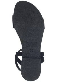 Black sandal with a textured rubber sole, featuring a flat design and a minimalist strapping system. Size marked as 37.